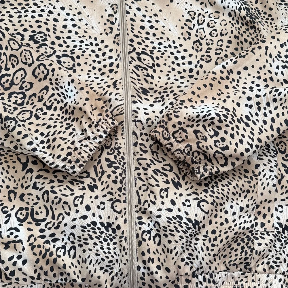 Allyson Whitmore leopard print zip-up windbreaker jacket w/golf club zipper pull